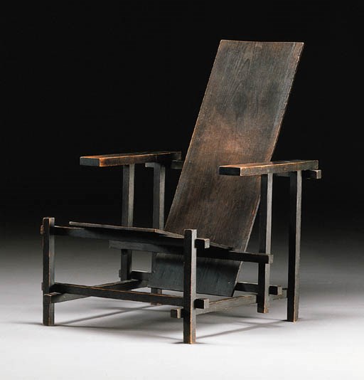 A dark stained armchair