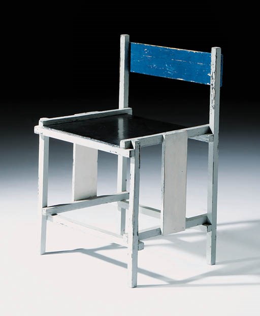 A grey, black and blue painted chair