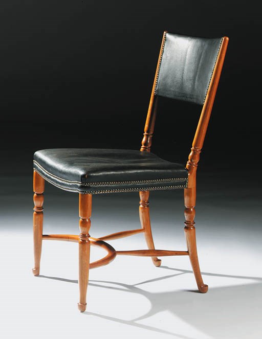 An upholstered walnut 'Captain's' Chair