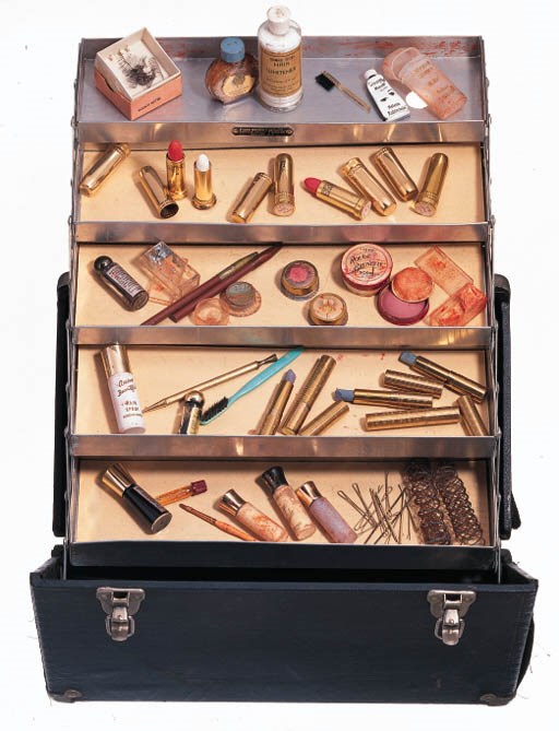 A TRAVELING CASE AND MAKE-UP