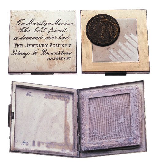 A STERLING SILVER COMPACT