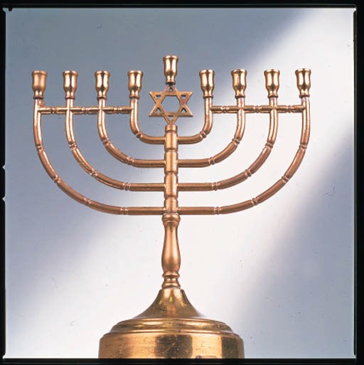 A BRASS PLATED METAL MUSICAL GOLD MENORAH