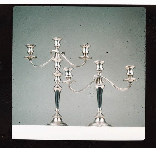 A PAIR OF STERLING SILVER CANDELSTICKS