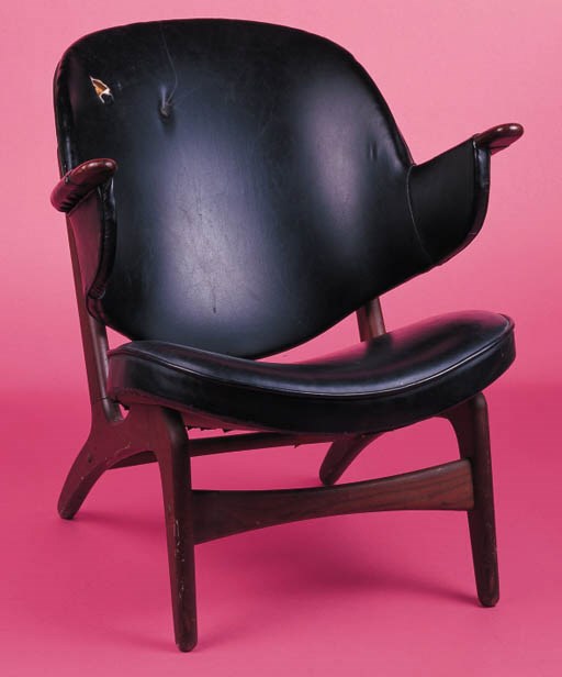 A MODERNISTIC BLACK LEATHERETTE AND MAHOGANY ARMCHAIR