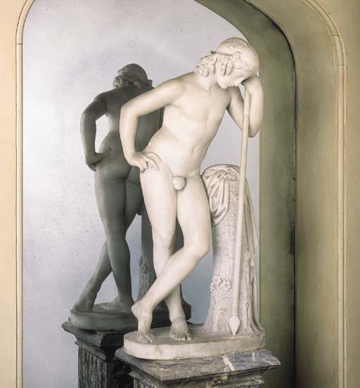 A SCULPTED MARBLE FIGURE OF NARCISSUS