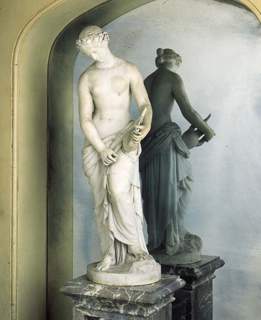 A SCULPTED MARBLE FIGURE OF SAPPHO