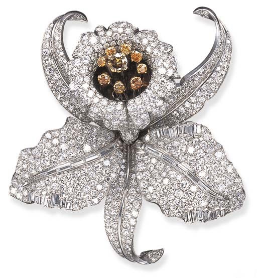 A SPECTACULAR DIAMOND AND COLORED DIAMOND BROOCH