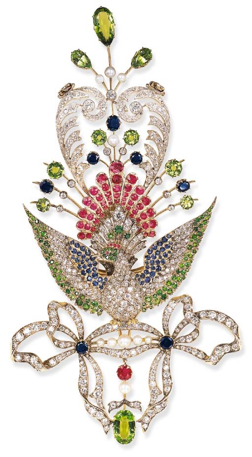 AN UNUSUAL ANTIQUE DIAMOND AND GEM-SET PEACOCK BROOCH