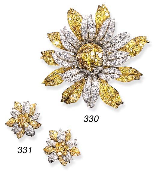 AN ATTRACTIVE PAIR OF DIAMOND AND BROWNISH ORANGY YELLOW DIAMOND FLOWER EAR CLIPS, BY VAN CLEEF & ARPELS