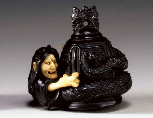 A Wood and Ivory Netsuke**