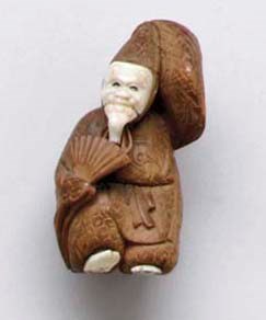 A Wood And Ivory Netsuke**