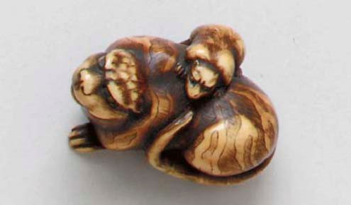 An Ivory and a Lacquered-Wood Netsuke**