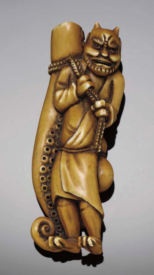 A Japanese stained ivory netsuke of an oni, late 19th Century