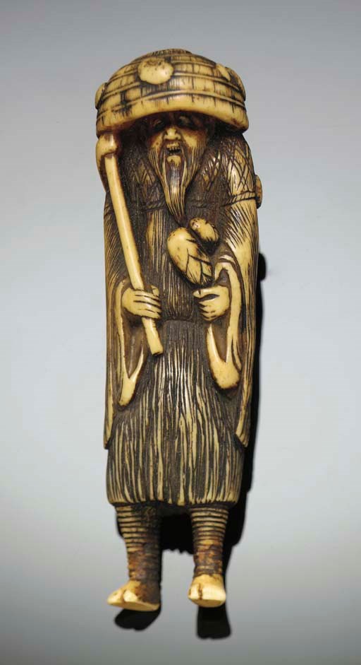 A Japanese ivory netsuke of a bearded figure, 18/19th Century