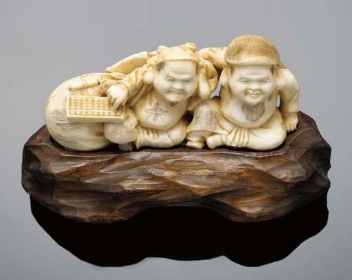 A Japanese ivory okimono of two figures, 19th Century