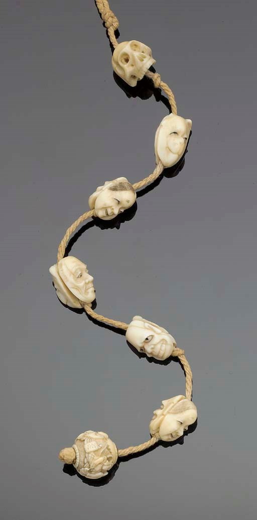 A group of seven Japanese ivory ojimi beads, 19th Century