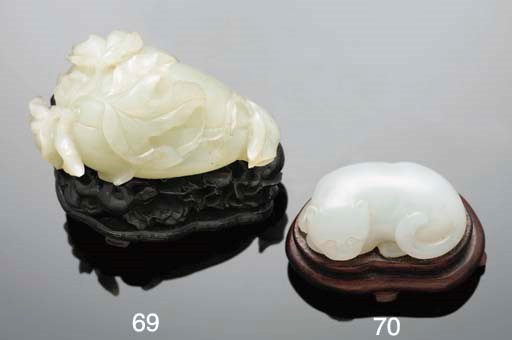 A Chinese white jade model of a cat, 19th Century