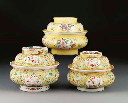Two similar famille rose, yellow ground bowls and covers, 19th century