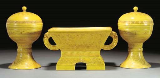 A pair of yellow glazed altar vessels and covers, dou, incised Guangxu six character marks and of the period