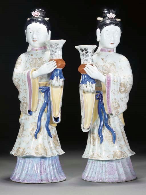 A pair of Chinese export style figural candlesticks, 20th century
