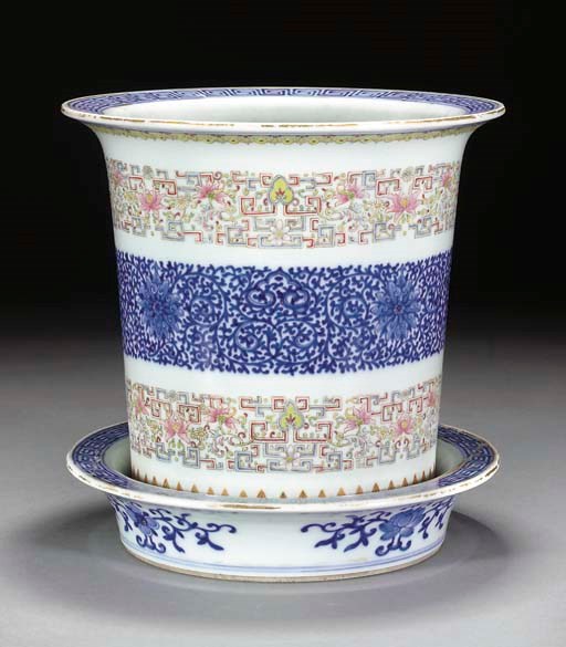A Chinese famille rose and underglaze blue jardiniere and stand, 19th Century