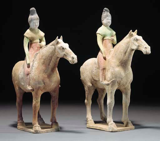 A pair of Chinese painted pottery models of female equestrians, Tang Dynasty