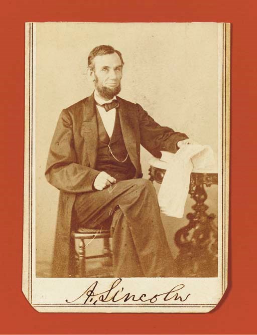 [LINCOLN, Abraham]. GARDNER, Alexander, Photographer. Carte-de-visite portrait photograph signed ("A. Lincoln") as President, taken at Gardner's studio at 7th and D Streets, Washington, D.C., 9 August 1863. Albumen photograph, 3½ x2½ including card backing, lower corners rounded, top edge trimmed, verso with Gardner's backstamp. BOLDLY SIGNED by the President in ink in the lower blank portion. Hamilton and Ostendorf, Lincoln in Photographs: An Album of Every Known Pose, O-71B.