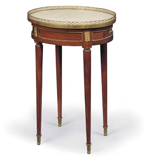 A LATE LOUIS XVI ORMOLU-MOUNTED MAHOGANY GUERIDON