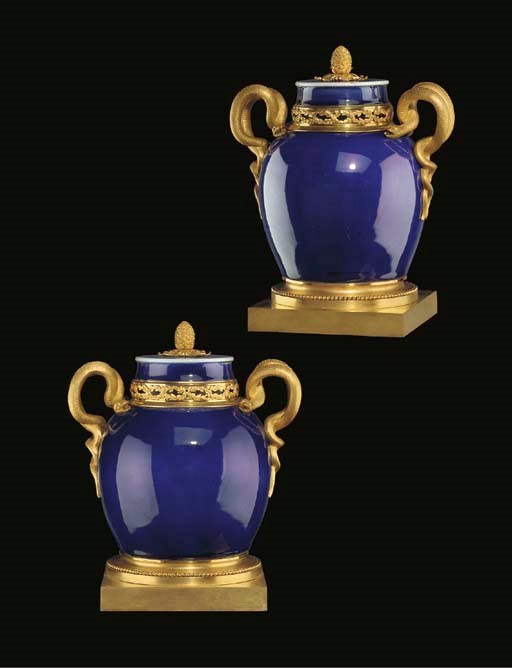 A PAIR OF LOUIS XVI ORMOLU-MOUNTED CHINESE POWDER BLUE PORCELAIN POT-POURRI VASES AND COVERS