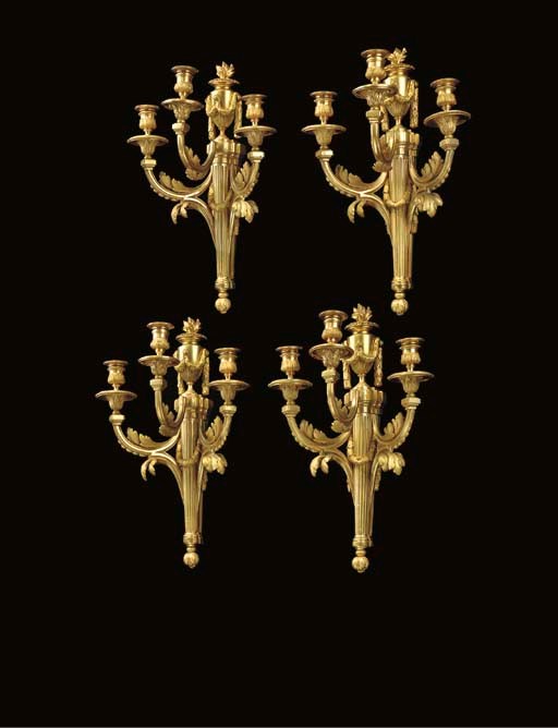 A SET OF FOUR FRENCH ORMOLU THREE-LIGHT WALL-LIGHTS