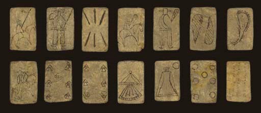 [WESTERN]. Apache Cards on Rawhide, Arizona, circa 1876. 13 of 40 cards, includes thirteen cards of a Monte pack (includes caballo, sota and 6 of swords, caballo, sota, 2 and ace of clubs, caballo, 7, 6 and ace of cups, and rey and 7 of coins).  The cards are unique in that they are sketched in a brown-black paint with no additional color.  The symbols for swords, clubs and coins are minimal, only the cup symbol is more detailed being reminiscent of the Spanish covered goblet employing the common Apache style of one triangle balanced on the point of another triangle, except on the caballo where the triangles are point to point.  The riders on horses are drawn from the Southwest with Mexican hats and cape-like serapes.  On the back of the 7 of cups is a notation in brownish black ink stating "Playing Cards Apaches of Arizona Dr. J. B. White USA." plus a pencil notation "13 pieces A'L." J. B. White is likely the individual who sent a pack of Apache cards to the Smithsonian Institution in 1876, they were given inventory number 21550 and were related to accession number 4869. Subsequently, 25 of the cards forming this pack found their way in 1909 as part of the Thomas B. Donaldson Collection at the Museum of American Indian in New York, number 2/3350, and two cards remain missing.  Size (varies) 3 in. (7.7 cm.) high, 1 7/8 in. (4.7 cm.) wide.  The rawhide has aged into a deep grayish tan, card edges show wear, the caballo of clubs has minor losses at the bottom.