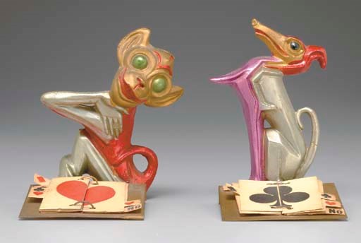 TWO PAINTED METAL TRUMP INDICATORS, MADE IN GERMANY.