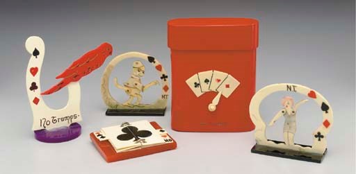 A GROUP OF FIVE CELLULOID TRUMP INDICATORS.