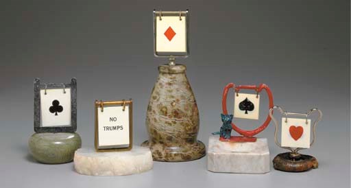 A GROUP OF FIVE TRUMP INDICATORS WITH STONE BASES.
