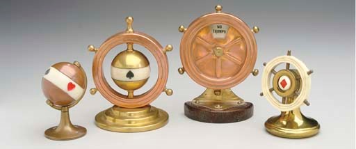 A GROUP OF FOUR CIRCULAR STYLE TRUMP INDICATORS.