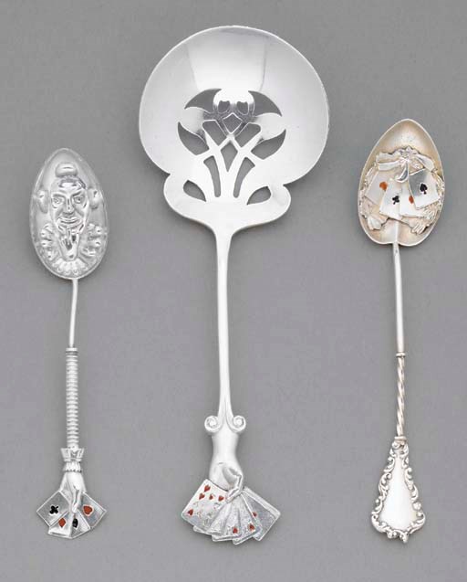 A GROUP OF THREE STERLING SILVER SPOONS.
