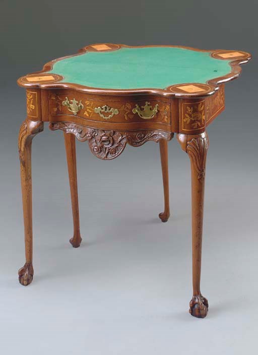 [CARD TABLE]. A DUTCH PEWTER-INLAID WALNUT AND MARQUETRY GATE-LEG CARD TABLE, MID 18TH CENTURY, THE INLAY POSSIBLY LATER.