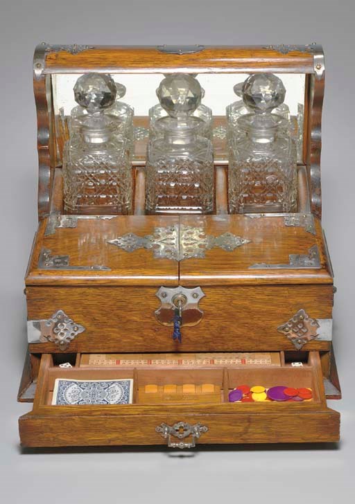 [TANTALUS]. Mahogany game box and decanter holder, circa 1870s.
