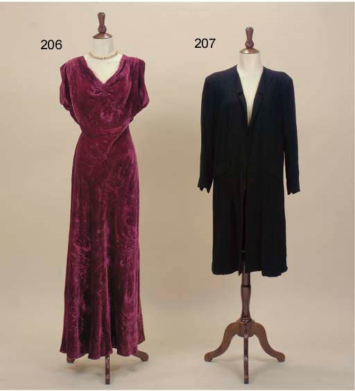 A COAT BY JEAN PATOU AND A BLACK SATIN MANTLE