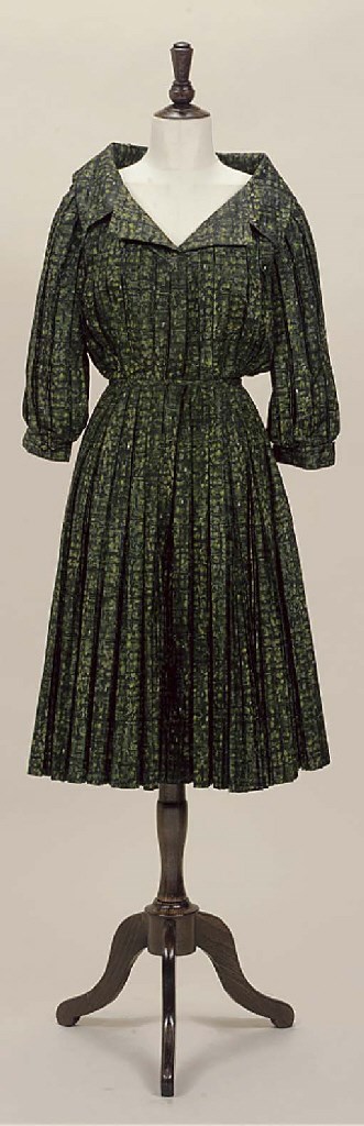AN OLIVE-GREEN SILK DAY DRESS BY CHRISTIAN DIOR PARIS