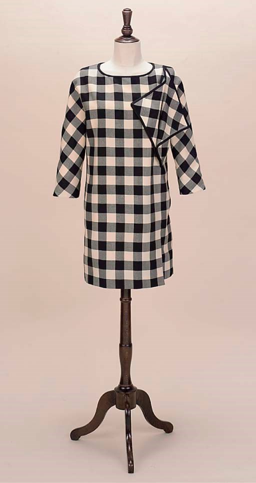 A BLACK AND WHITE CHECKED WOOL DRESS WITH FLYING PANELS