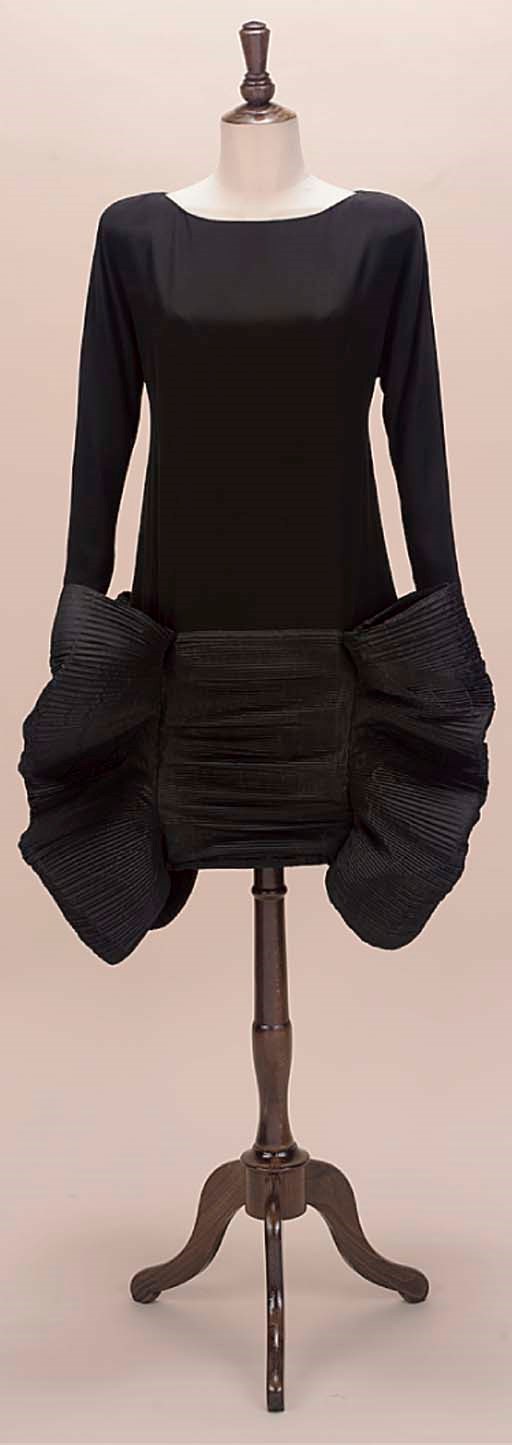 A SCULPTURAL COCKTAIL DRESS OF BLACK SILK FAILLE
