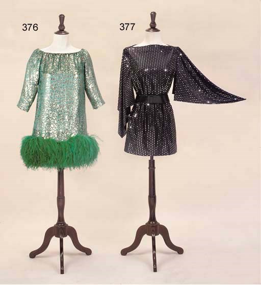 AN APRICOT WOOL CAPE AND GREEN DRESS
