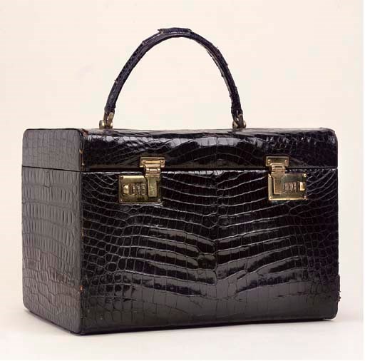 A BLACK CROCODILE JEWELLERY CASE BY GUCCI