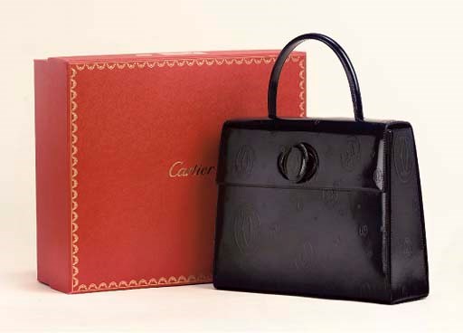 A DEEP BLUE HANDBAG, CARTIER