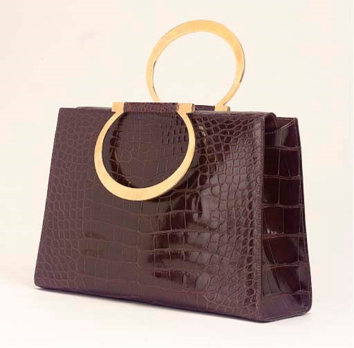 A CHESTNUT CROCODILE HANDBAG, CELINE