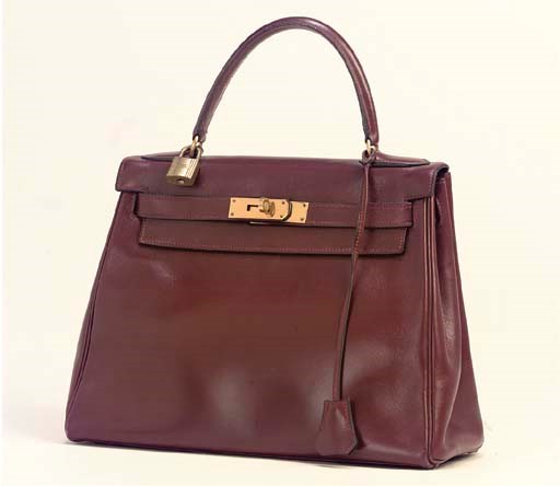 AN OXBLOOD-RED LEATHER KELLY BAG, HERMÈS