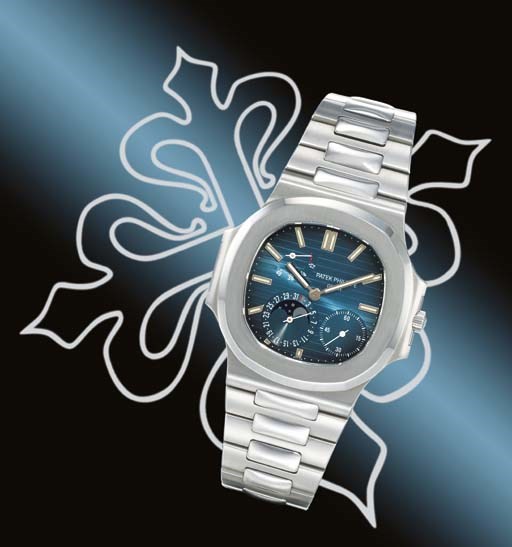 PATEK PHILIPPE. A FINE AND RARE STAINLESS STEEL AUTOMATIC WRISTWATCH WITH POWER RESERVE, DATE, PHASES OF THE MOON AND BRACELET