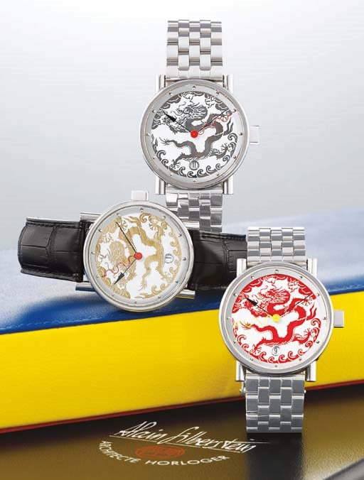 ALAIN SILBERSTEIN. A SET OF THREE RARE LIMITED EDITION STAINLESS STEEL AUTOMATIC WRISTWATCHES WITH CENTRE SECONDS, DATE AND ENAMEL DIALS