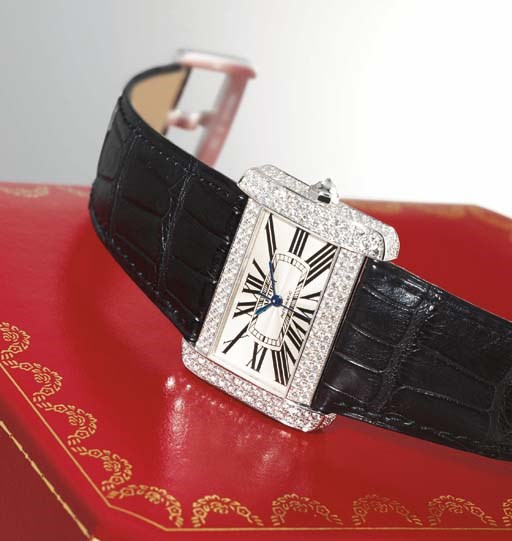 CARTIER. A RARE 18K WHITE GOLD AND DIAMOND-SET RECTANGULAR AUTOMATIC WRISTWATCH